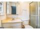 Bathroom featuring a vanity with a marble sink and a glass-door shower at 4230 Iris Brooke Ln, Snellville, GA 30039