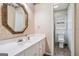 Bathroom featuring a vanity with decorative mirror and a separate toilet area at 4230 Iris Brooke Ln, Snellville, GA 30039