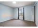 Neutral bedroom with carpeted floors and a bright window for ample natural light at 4230 Iris Brooke Ln, Snellville, GA 30039