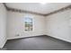 Neutral bedroom with carpeted floors, wallpaper, and a bright window at 4230 Iris Brooke Ln, Snellville, GA 30039