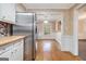 Open dining area with hardwood floors, stainless steel refrigerator, and ample natural light at 4230 Iris Brooke Ln, Snellville, GA 30039
