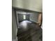 Finished basement features dark wood look floors and gray walls, egress window and finished door at 281 New Hope Dr, Mcdonough, GA 30252