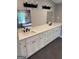 Elegant bathroom featuring dual sinks with white cabinets, dark fixtures, and a large mirror at 281 New Hope Dr, Mcdonough, GA 30252