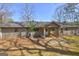 The backyard features a patio, a door to the house and beautiful green grass at 130 Bradley Pl, Mcdonough, GA 30253