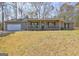 Charming single-story home with a covered porch and attached garage, set on a grassy lot at 130 Bradley Pl, Mcdonough, GA 30253
