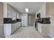 Kitchen with white cabinets, granite countertops, tile flooring, and stainless steel appliances at 130 Bradley Pl, Mcdonough, GA 30253