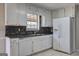 Kitchen with white cabinetry, double sink, and dishwasher at 130 Bradley Pl, Mcdonough, GA 30253