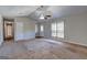 Bright living room with a vaulted ceiling, carpet flooring and a large window at 130 Bradley Pl, Mcdonough, GA 30253