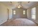 Spacious main bedroom with neutral walls, vaulted ceiling, carpet flooring, and natural light at 130 Bradley Pl, Mcdonough, GA 30253