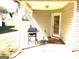 Covered back porch is ideal for grilling, featuring a grill and entry door at 40 Pebble Brooke Ct, Covington, GA 30016