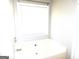 Neutral bathroom features a bathtub at 40 Pebble Brooke Ct, Covington, GA 30016
