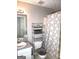 Cozy bathroom featuring a tub/shower combo and a single sink vanity at 40 Pebble Brooke Ct, Covington, GA 30016
