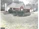 Charming brick home featuring a well-manicured front yard and attached two-car garage at 40 Pebble Brooke Ct, Covington, GA 30016