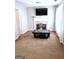 Living room features a fireplace, large windows, and neutral walls at 40 Pebble Brooke Ct, Covington, GA 30016