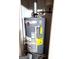 Image shows the home's Rheem Performance water heater with visible Energy Guide label at 40 Pebble Brooke Ct, Covington, GA 30016