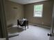 Modest bedroom with neutral walls, window providing natural light, and space for customization at 6733 Jojanne Ln, Lithonia, GA 30038
