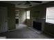 Living room with a fireplace, doorway to a bathroom and 2 windows at 6733 Jojanne Ln, Lithonia, GA 30038