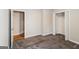 Bedroom featuring carpet floors, closet with double doors, and neutral paint throughout at 364 Valleyside Dr, Dallas, GA 30157