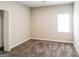 Cozy bedroom featuring carpet floors, a window with blinds, and neutral paint throughout at 364 Valleyside Dr, Dallas, GA 30157