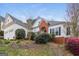 Exterior view of a home featuring a two-car garage and landscaped front yard at 364 Valleyside Dr, Dallas, GA 30157