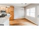 Eat-in kitchen featuring wood floors, stainless steel appliances, and granite countertops at 364 Valleyside Dr, Dallas, GA 30157