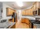 Kitchen with wood cabinets, granite countertops, and stainless-steel appliances at 364 Valleyside Dr, Dallas, GA 30157