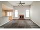 Spacious living room with a fireplace, large windows, and an open floor plan at 364 Valleyside Dr, Dallas, GA 30157