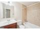 Bathroom with vanity, toilet, and tiled shower-tub combination at 3396 Framingham Dr, Lithonia, GA 30038