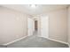 Inviting bedroom with neutral carpet and an open doorway at 3396 Framingham Dr, Lithonia, GA 30038
