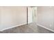 Bedroom featuring an open door, neutral paint, and gray wood-style floors at 3396 Framingham Dr, Lithonia, GA 30038