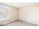 This bedroom has a window that provides natural light and gray wood-style floors at 3396 Framingham Dr, Lithonia, GA 30038