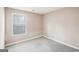 A cozy bedroom with new carpet and a bright window at 3396 Framingham Dr, Lithonia, GA 30038