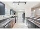 Modern kitchen featuring stainless steel appliances, granite countertops, and an open layout at 3396 Framingham Dr, Lithonia, GA 30038