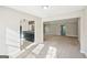Open-concept layout with a view of the kitchen featuring dark cabinets at 3396 Framingham Dr, Lithonia, GA 30038