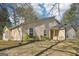 Side view of the home showcasing the siding, windows, and well-maintained lawn at 3396 Framingham Dr, Lithonia, GA 30038