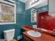 Bathroom featuring large vanity mirror, window, toilet, and shower/tub combo at 1001 Stagecoach Rd, Stockbridge, GA 30281