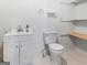 Bathroom featuring a modern vanity with sink, toilet, and added shelving at 1001 Stagecoach Rd, Stockbridge, GA 30281