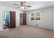 View of a bright carpeted bedroom, next to the bath and large window at 1001 Stagecoach Rd, Stockbridge, GA 30281