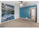 A spacious bedroom that features a mural and blue accent wall at 1001 Stagecoach Rd, Stockbridge, GA 30281