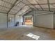Large empty garage with lots of space and a small amount of furniture at 1001 Stagecoach Rd, Stockbridge, GA 30281