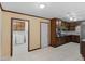 Spacious kitchen with stainless steel appliances, tile floor, and view of laundry area at 1001 Stagecoach Rd, Stockbridge, GA 30281