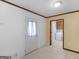 Laundry room with tile floors, standard washer/dryer, and view into the kitchen at 1001 Stagecoach Rd, Stockbridge, GA 30281