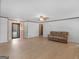 Open-concept living room with wood floors, neutral walls, and easy access to the foyer at 1001 Stagecoach Rd, Stockbridge, GA 30281