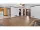 Bright, open-concept living room with a smooth flooring and access to kitchen, laundry and foyer at 1001 Stagecoach Rd, Stockbridge, GA 30281