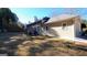 Back of house with a spacious backyard, perfect for outdoor activities and relaxation at 185 Ridgewood Dr, Fayetteville, GA 30215