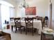 Traditional dining room with chandelier, large windows, and seating for six at 185 Ridgewood Dr, Fayetteville, GA 30215