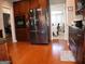 Well-equipped kitchen with stainless steel refrigerator, ample cabinet space, and hardwood floors at 185 Ridgewood Dr, Fayetteville, GA 30215
