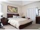 Spacious main bedroom with a large bed, neutral carpet, and decorative art at 185 Ridgewood Dr, Fayetteville, GA 30215