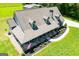 Aerial view showcasing the charming front porch, landscaped yard, and well-manicured grounds at 640 Lovell Rd, Temple, GA 30179