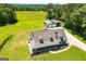 Aerial view of the property showcases the expansive lawn, detached garage, and meticulously landscaped yard at 640 Lovell Rd, Temple, GA 30179